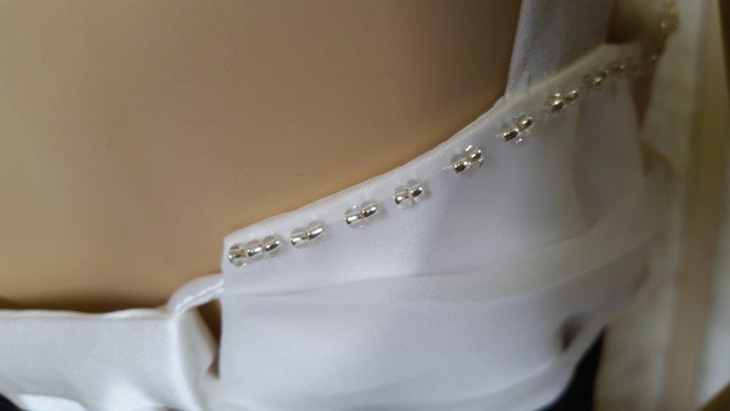 beading along the whole top of the dress