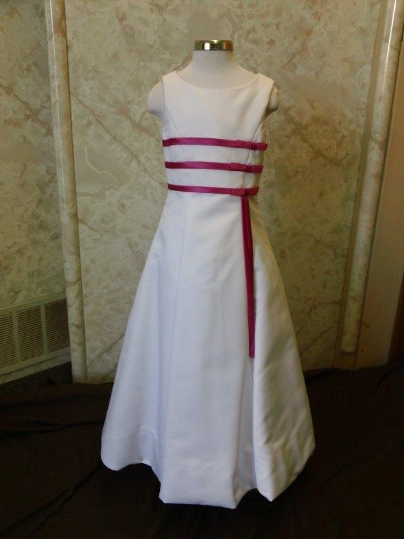 long white dress with fuschia ribbons