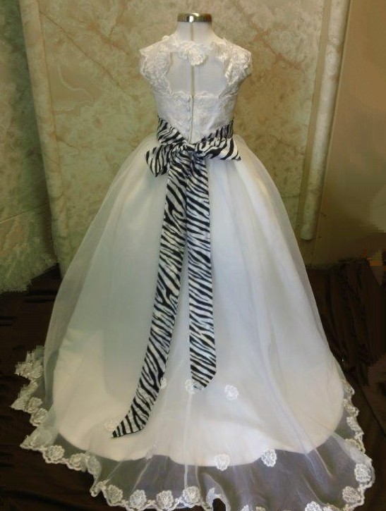 white flower girl dress with zebra print sash