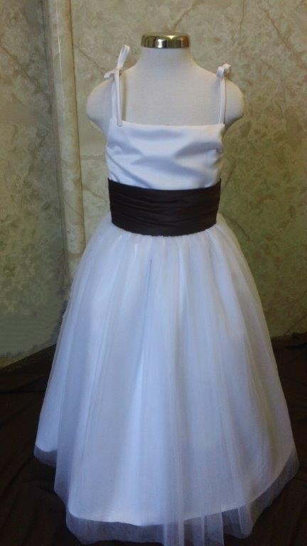 white dress with chocolate sash