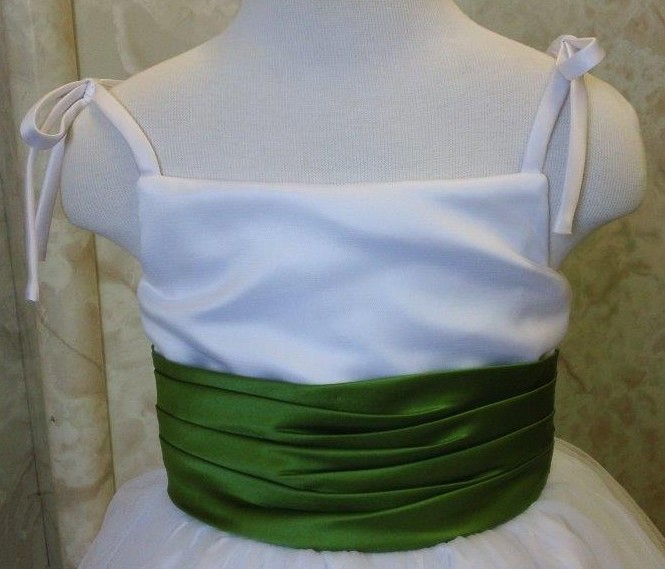 white dress with olive green sash