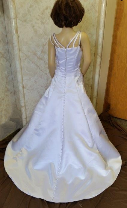 White spaghetti strap Miniature brides gown with embroidered bodice, and buttons down the train.