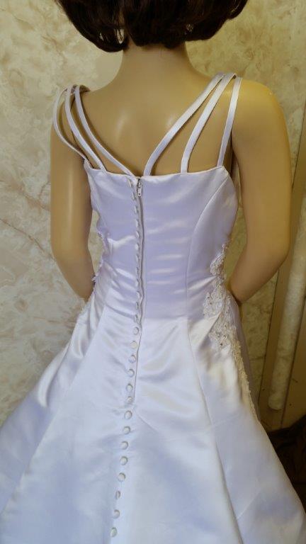 White spaghetti strap Miniature brides gown with embroidered bodice, and buttons down the train.