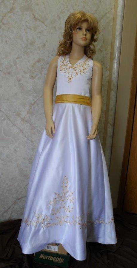 white dress with gold embroidery and sash