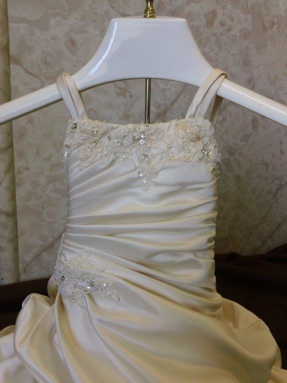 pleated infant wedding gown with cascading skirt