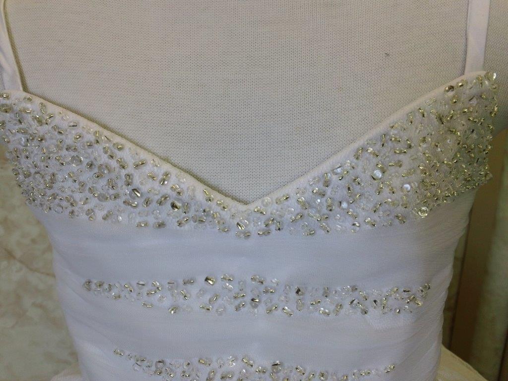 White beaded sweetheart bodice pageant gown