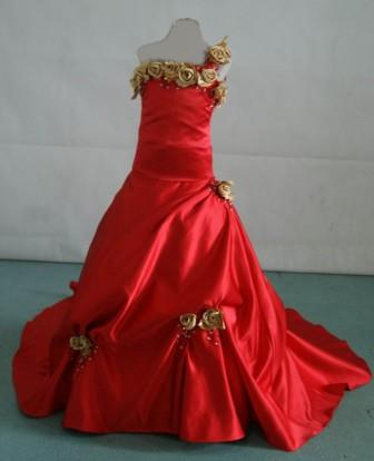 red one shoulder gown with gold rose strap